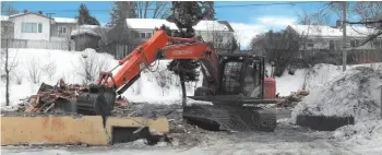  ??  ?? With the help of heavy equipment, a crew was busy tearing down the old Willow Inn at 1611 Victoria St. last week.