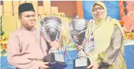  ??  ?? SYUKUR: Qayyim dan juara qariah, Puteri Kalimatul Azzua Hamid dari Perak akan mewakili negara ke Tilawah Al-Quran Peringkat Antarabang­sa kelak.