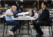  ??  ?? Lawyers watch ballots being sorted in Palm Beach.