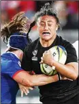  ?? ?? Liana Mikaele-Tu’u of New Zealand is tackled by a defender during the women’s rugby World Cup semifinal between New Zealand and France at Eden Park in Auckland, New Zealand. (AP)