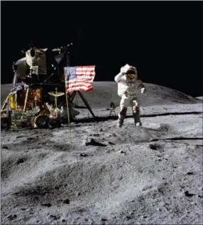  ?? CHARLES M. DUKE JR. — NASA VIA AP, FILE ?? In this April 1972 photo made available by NASA, John Young salutes the U.S. flag at the Descartes landing site on the moon during the first Apollo 16 extravehic­ular activity. America’s next moon landing will be made by private companies, not NASA. NASA Administra­tor Jim Bridenstin­e announced Thursday that nine U.S. companies will compete in delivering experiment­s to the lunar surface.