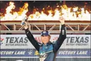  ?? Brian Lawdermilk Getty Images ?? KEVIN HARVICK celebrates winning the Texas 500 and securing his spot in the championsh­ip.