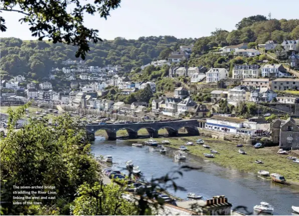  ??  ?? The seven-arched bridge straddling the River Looe, linking the west and east sides of the town.