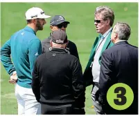  ?? GETTY IMAGES ?? 3 Decision time: Johnson holds his back as he tells the Augusta officials he can’t carry on