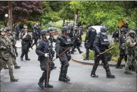  ?? STEVE RINGMAN/THE SEATTLE TIMES VIA AP ?? Seattle Police finish their sweep Wednesday, July 1, on the north end of Cal Anderson Park, sweeping everyone off the grounds.