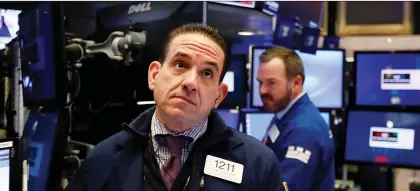  ?? RICHARD DREW/THE ASSOCIATED PRESS ?? A trader works on the floor of the New York Stock Exchange on Friday. The interestin­g thing about changing narratives is that often the underlying facts haven’t changed — the issue or concern has just been out of the spotlight, writes Tom Bradley.