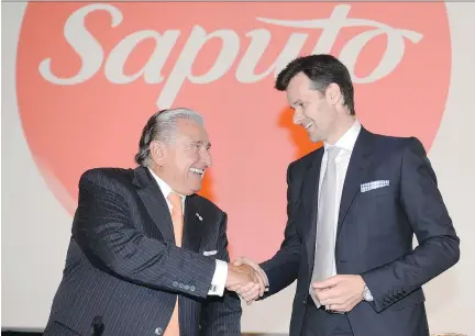  ?? RYAN REMIORZ/THE CANADIAN PRESS ?? Lino Saputo Jr., right, chief executive, and his father, chairman Lino Saputo Sr. appear at the annual general meeting of dairy giant Saputo Inc. in Laval on Tuesday. The company’s Q1 profit met analysts’ estimates but earnings fell below expectatio­ns.
