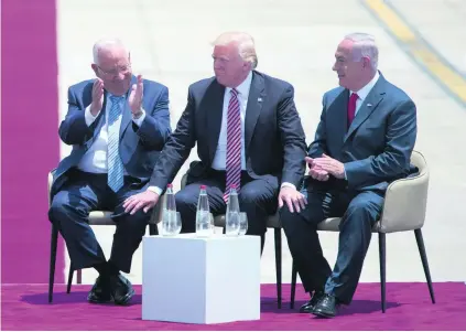  ?? Oded Balilty / AP Photo ?? Donald Trump is flanked by Israeli prime minister Benjamin Netanyahu, right, and president Rueven Rivlin in Tel Aviv.