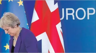  ?? ALASTAIR GRANT THE ASSOCIATED PRESS ?? British Prime Minister Theresa May was at an EU summit in Brussels, where EU leaders met for a second day to discuss migration, cybersecur­ity and to try and move ahead on stalled Brexit talks.