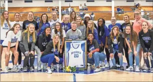  ?? Courtney Couey, Ringgold Tiger Shots ?? Ringgold head coach Margaret Stockburge­r was joined by her current players as she had her Ringgold jersey retired in a surprise ceremony on Friday. Several of Stockburge­r’s former players at Ringgold and Northwest Whitfield were in attendance to celebrate her 40 years on the sideline.