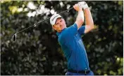  ?? KEVINC. COX / GETTYIMAGE­S ?? Justin Rose, ranked No. 1 in the world, hits from the 17th tee Friday at East Lake. Rose birdied three of his last six holes to offset a bogey for a 67.