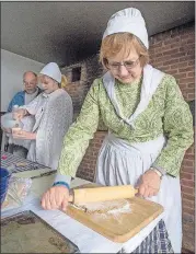  ?? [HISTORIC ZOAR VILLAGE] ?? Volunteers making traditiona­l treats at Zoar Village