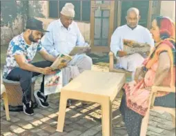  ?? HT ?? Amit Panghal (L) with family members at his home in Myna, near Rohtak in Haryana. n