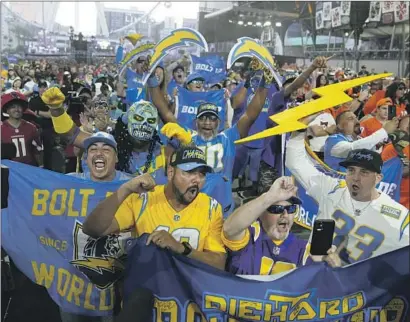  ?? FANS AT THE DRAFT John Locher Associated Press ?? were pumped for the Chargers, who picked safety JT Woods from Baylor in the third round Friday.