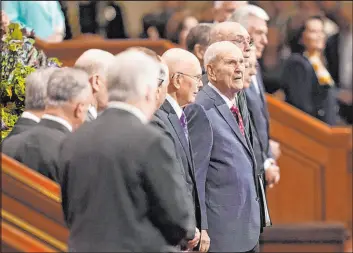  ?? Rick Bowmer The Associated Press ?? The Church of Jesus Christ of Latter-day Saints President Russell M. Nelson, center, looks on during the church’s conference Saturday in Salt Lake City.