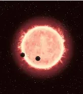  ?? NASA, ESA, AND G. BACON (STSCI) ?? This artist’s impression shows the star TRAPPIST1 with two planets transiting across it.