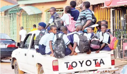  ?? Photo: ?? Pupils being conveyed to school along Byazin Kubwa in Abuja yesterday.