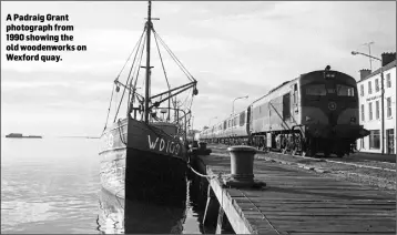  ??  ?? A Padraig Grant photograph from 1990 showing the old woodenwork­s on Wexford quay.