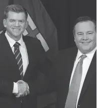  ?? DAVID BLOOM / POSTMEDIA NEWS ?? Wildrose Party Leader Brian Jean and Alberta PC Leader Jason Kenney announce the merger Thursday.