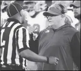  ?? ?? UCLA coach Chip Kelly talks with an official during the first half of the team’s game against Arizona State, last Saturday, in Tempe, Ariz. The Bruins host Arizona today.