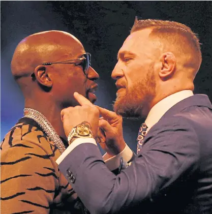  ??  ?? Floyd Mayweather, left, and Conor McGregor during a promotiona­l event in London last month.