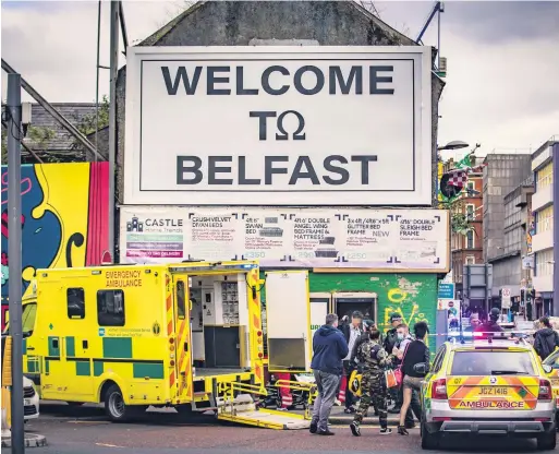  ??  ?? Attack: Police and ambulance at the scene of Monday’s stabbing incident in Castle Street