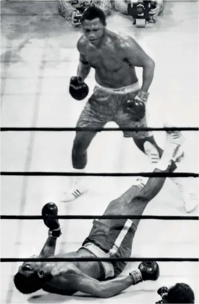  ??  ?? DEFINING MOMENT: Frazier stands over Ali after felling his rival in the final round with that famous left hook
l Originally published in the BN bookazine, Ali vs Frazier, available at shop.kelsey.co.uk now