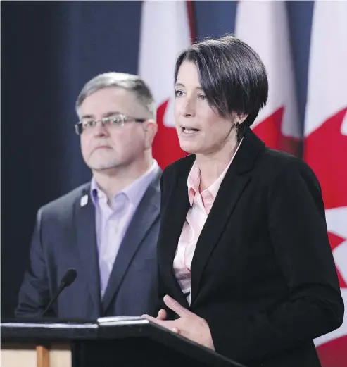  ?? SEAN KILPATRICK / THE CANADIAN PRESS FILES ?? Debi Daviau, right, president of the Profession­al Institute of the Public Service of Canada, says the federal government needs to act fast to replace the troubled Phoenix pay system if it wants to win back public servants’ confidence.