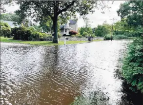  ?? Sarah Kyrcz / For Hearst Connecticu­t Media ?? West Wharf Beach in Madison and the entrance to the Surf Club and part of the Madison Country Club golf course are flooded following Ida.