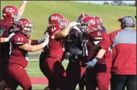  ?? Photo courtesy of Henderson State ?? Freshman kicker Temo Martinez (center) is congratula­ted by teammates after hitting a 40-yard field goal with five seconds left Saturday to give Henderson State a 20-17 victory over Southeaste­rn Oklahoma State in Arkadelphi­a.