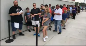  ?? MARK PODOLSKI — THE NEWS-HERALD ?? Fans line up at the Best Buy in Parma on Aug. 15 for the “We Love You 3,000” event promoting the release of “Avengers: Endgame” Blu Ray.