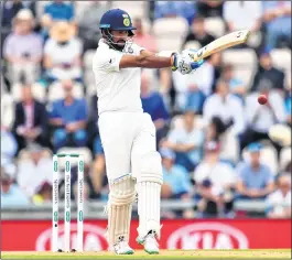  ??  ?? Cheteshwar Pujara pulls during the second day of the fourth Test against England in Southampto­n on Friday.