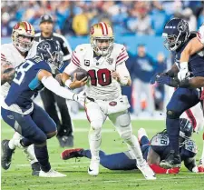  ?? MARK ZALESKI THE ASSOCIATED PRESS ?? 49ers quarterbac­k Jimmy Garoppolo was playing with an injury when he threw two intercepti­ons against the Titans on Thursday.