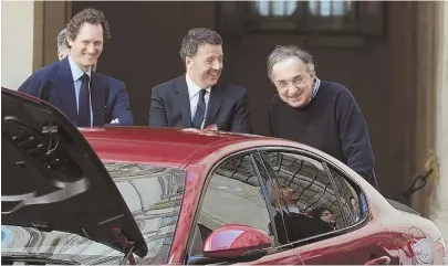  ?? AP FILE PHOTO ?? MARCHIONNE ERA: Fiat Chrysler CEO Sergio Marchionne, right, Italian Premier Matteo Renzi, center, and Fiat Chrysler Chairman John Elkann, pose behind the new Alfa Romeo Giulia sedan in 2016.