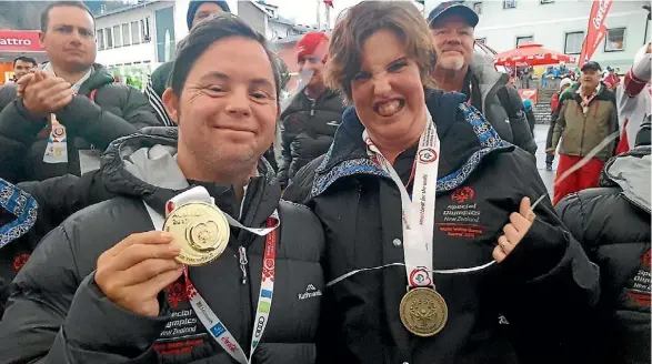  ??  ?? Horowhenua skier Cameron Jarvis and Rebecca Heath with their winter Special Olympics medals.