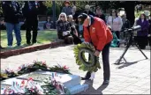  ?? Photos by Doug Walker ?? BELOW: Korean War veteran Charles Patterson lays a wreath at the Tomb of the Known Soldier during the service.