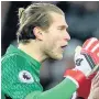  ??  ?? CONTACT Liverpool keeper Karius protests