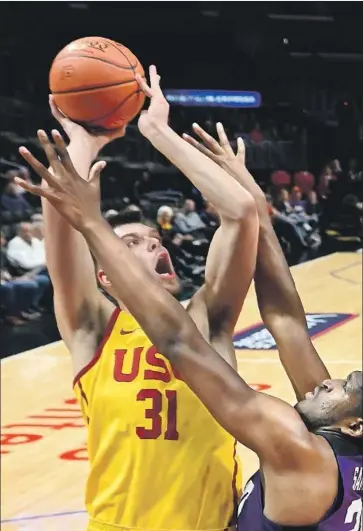  ?? Mark J. Terrill Associated Press ?? USC FORWARD Nick Rakocevic, shooting over TCU’s Kevin Samuel, averages 15 points and 11 rebounds.