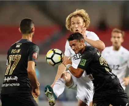  ??  ?? Floriana's Matias Garcia (R) clear the ball ahead of Rauno Alliku of Flora Talinn during the first half of the UEFA Europa League Third qualifying round match at the National Stadium. Photo © Domenic Aquilina