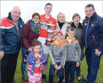  ??  ?? Banteer player Kevin Tarrant celebratin­g with family members after the Duhallow JAHC Final win in Newmarket.