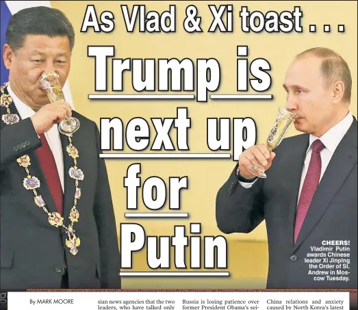  ??  ?? CHEERS! Vladimir Putin awards Chinese leader Xi Jinping the Order of St. Andrew in Moscow Tuesday.