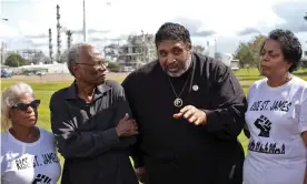  ??  ?? The Rev William Barber stands at the entrance of the Ponchartra­in Works facility in Reserve, Louisiana, flanked by Robert Taylor, director of Concerned Citizens of St John the Baptist, and Sharon Lavigne, president of Rise St James. Photograph: Julie Dermansky for the Guardian