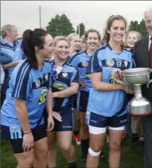  ??  ?? Mairéad White receives the Noel Quill Memorial Cup from Denis Nolan (Co. Chairman).