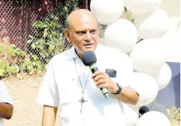  ?? ?? Monsignor Gregory Ramkissoon, founder, Mustard Seed Communitie­s, speaking at the UTech, Jamaica Mustard Seed Communitie­s Centre 25th anniversar­y blessing ceremony held on January 31, on the grounds of the centre located in Papine.