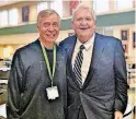  ?? [PHOTO PROVIDED] ?? Bishop McGuinness Catholic High School Principal David Morton, left, and keynote speaker Mike Turpen pose for a picture during Career Day at the school.