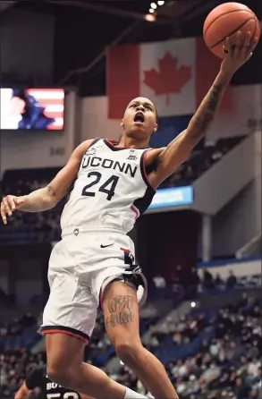  ?? Jessica Hill / Associated Press ?? UCnn’s Jordan Hawkins goes up for a basket on a breakaway against Butler during Tuesday’s game in Hartford.