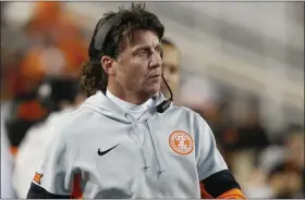  ?? ASSOCIATED PRESS FILE ?? Oklahoma State head coach Mike Gundy walks on the sidelines during a game against Oklahoma in 2019.