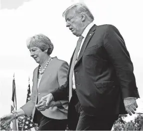  ?? PABLO MARTINEZ MONSIVAIS/AP ?? President Donald Trump and British Prime Minister Theresa May wrap up their news conference Friday in Buckingham­shire, England. Trump heads to Helsinki on Monday to meet with Russia’s Vladimir Putin.