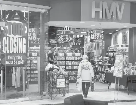  ?? THE CANADIAN PRESS ?? An HMV outlet in Dartmouth, N.S., holds a store-closing sale. The retailer went bust early last year, but many music lovers out there still love compact discs.