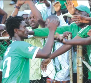  ??  ?? CROWD FAVOURITE ... CAPS United’s Nigerian forward Abasarim Chidiebere mingles with his team’s fans after the Green Machine’s draw against Bulawayo City at Hartsfield on Wednesday